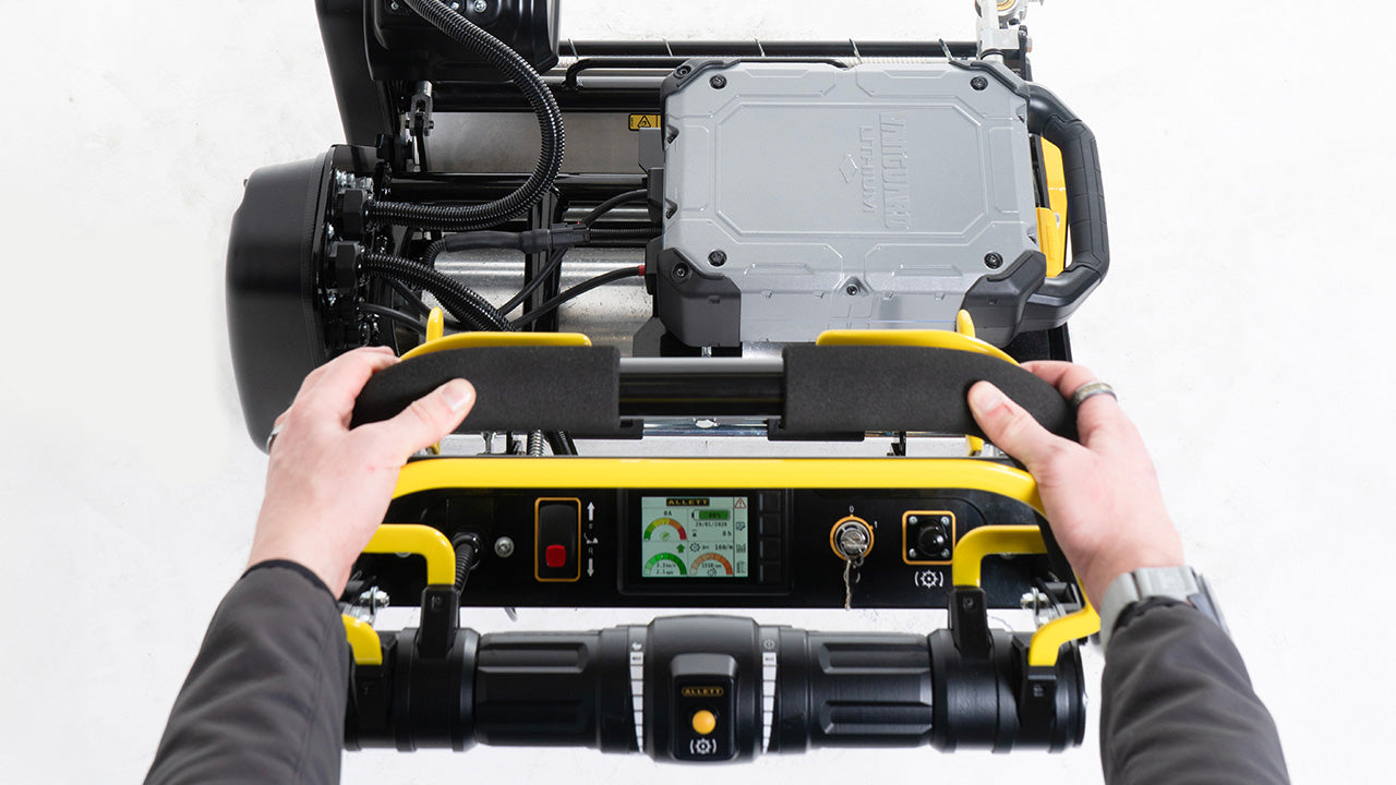 Operator view of Allett Omnia 34 showing LCD display and handlebar controls