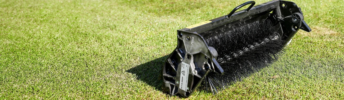 QC Lawn Brush cartridge on green grass